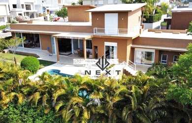 Imagem: A casa em condomínio possui 5 Dormitórios, 5 Banheiros, 4