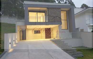 Imagem: A casa possui 3 Dormitórios, 4 Banheiros, 3 Vagas na garagem