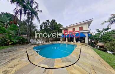 Imagem: A casa possui 5 Dormitórios, 5 Banheiros, 5 Vagas na garagem