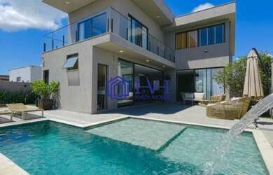 Imagem: A casa possui 4 Dormitórios, 4 Banheiros, 4 Vagas na garagem