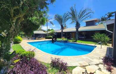 Imagem: A casa possui 4 Dormitórios, 5 Banheiros, 5 Vagas na garagem