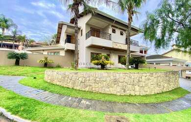 Imagem: A casa possui 5 Dormitórios, 4 Banheiros, 5 Vagas na garagem