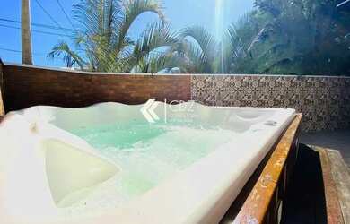 Imagem: A casa possui 3 Dormitórios, 5 Banheiros, 4 Vagas na garagem