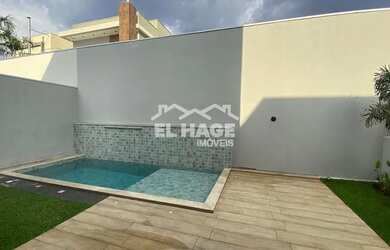 Imagem: A casa possui 4 Dormitórios, 5 Banheiros, 4 Vagas na garagem