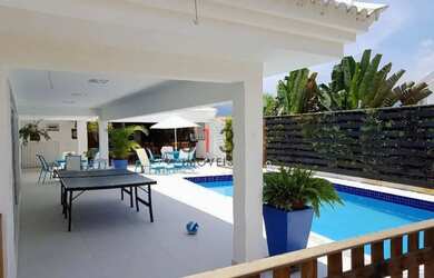 Imagem: A casa possui 5 Dormitórios, 4 Banheiros, 2 Vagas na garagem