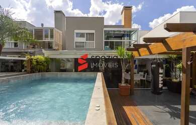 Imagem: A casa possui 3 Dormitórios, 5 Banheiros, 4 Vagas na garagem