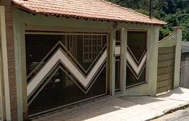 Imagem: A casa possui 5 Dormitórios, 4 Banheiros, 5 Vagas na garagem