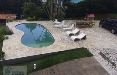 Imagem: A casa possui 4 Dormitórios, 5 Banheiros, 3 Vagas na garagem