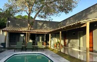 Imagem: A casa possui 3 Dormitórios, 3 Vagas na garagem e está localizado