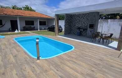 Imagem: A casa possui 3 Dormitórios, 3 Banheiros, 4 Vagas na garagem