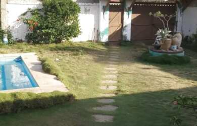 Imagem: A casa possui 4 Dormitórios, 4 Banheiros, 4 Vagas na garagem