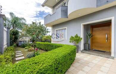 Imagem: A casa possui 5 Dormitórios, 5 Banheiros, 4 Vagas na garagem