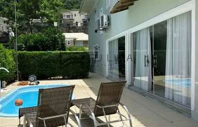 Imagem: A casa possui 5 Dormitórios, 5 Banheiros, 3 Vagas na garagem