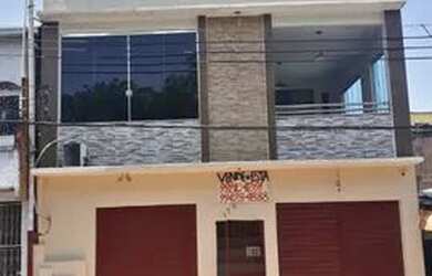 Imagem: A casa possui 5 Dormitórios, 4 Banheiros, 2 Vagas na garagem