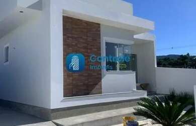 Imagem: A casa possui 3 Dormitórios, 2 Banheiros, 2 Vagas na garagem