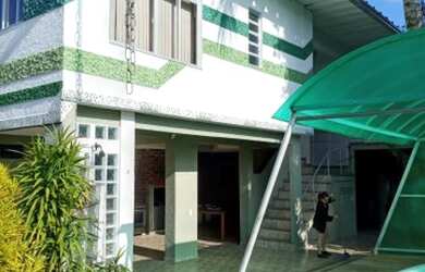 Imagem: A casa possui 3 Dormitórios, 4 Banheiros, 3 Vagas na garagem