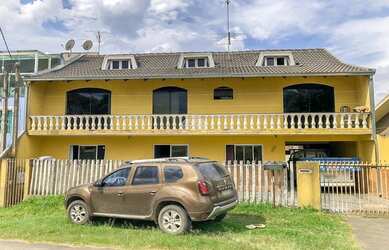 Imagem: A casa possui 5 Dormitórios, 2 Banheiros, 2 Vagas na garagem