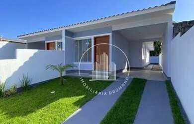 Imagem: A casa possui 2 Dormitórios, 2 Banheiros, 2 Vagas na garagem