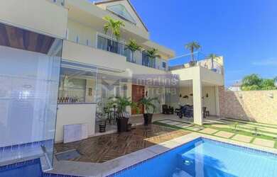 Imagem: A casa em condomínio à venda possui 5 Dormitórios, 5 Banheiros