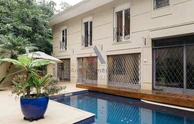 Imagem: A casa possui 3 Dormitórios, 5 Banheiros, 5 Vagas na garagem