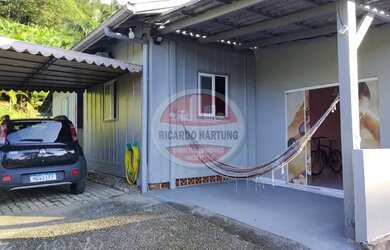 Imagem: A casa possui 4 Dormitórios, 1 Banheiro, 1 Vaga na garagem