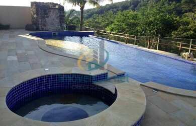 Imagem: A casa possui 5 Dormitórios, 5 Banheiros, 5 Vagas na garagem