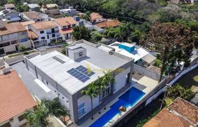 Imagem: A casa possui 4 Dormitórios, 5 Banheiros, 5 Vagas na garagem