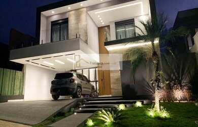 Imagem: A casa possui 4 Dormitórios, 5 Banheiros, 4 Vagas na garagem