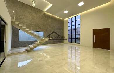 Imagem: A casa possui 4 Dormitórios, 5 Banheiros, 4 Vagas na garagem