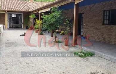 Imagem: A casa possui 5 Dormitórios, 4 Banheiros, 5 Vagas na garagem