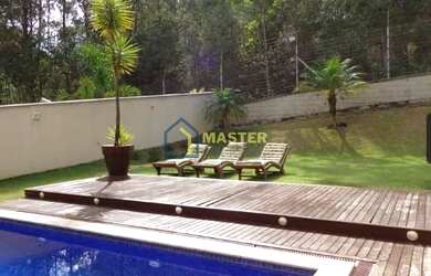 Imagem: A casa possui 5 Dormitórios, 4 Banheiros, 4 Vagas na garagem