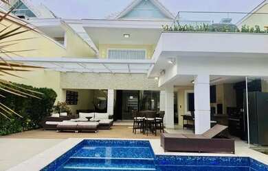 Imagem: A casa possui 5 Dormitórios, 5 Banheiros, 5 Vagas na garagem