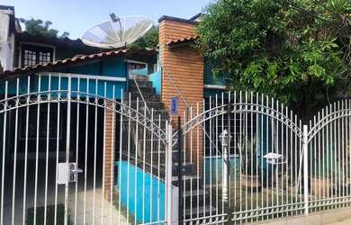 Imagem: A casa possui 2 Dormitórios, 1 Banheiro, 1 Vaga na garagem