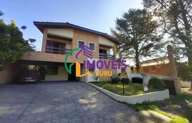 Imagem: A casa em condomínio possui 4 Dormitórios, 5 Banheiros, 5