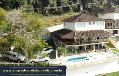 Imagem: A casa em condomínio possui 4 Dormitórios, 5 Banheiros, 2