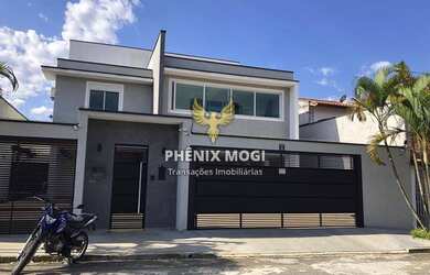 Imagem: A casa e possui 4 Dormitórios, Suítes, 5 Banheiros, 4 Vagas