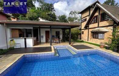 Imagem: A casa em condomínio possui 4 Dormitórios, 5 Banheiros, 5