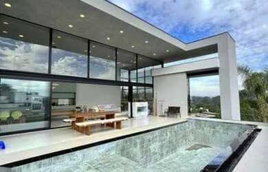 Imagem: A casa em condomínio possui 4 Dormitórios, 5 Banheiros, 5