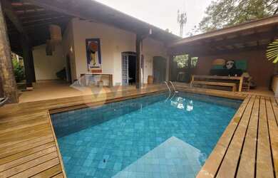 Imagem: A casa possui 3 Dormitórios, 4 Banheiros, 4 Vagas na garagem