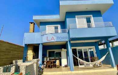 Imagem: A casa possui 4 Dormitórios, 4 Banheiros, 4 Vagas na garagem