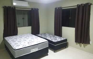 Imagem: A casa possui 4 Dormitórios, 3 Vagas na garagem e está localizado