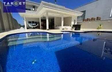 Imagem: A casa em condomínio possui 4 Dormitórios, 4 Banheiros, 5