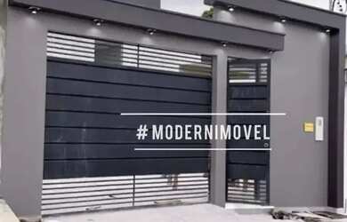 Imagem: A casa possui 3 Dormitórios, 2 Banheiros, 2 Vagas na garagem