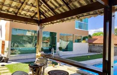 Imagem: A casa possui 3 Dormitórios, 4 Banheiros, 4 Vagas na garagem