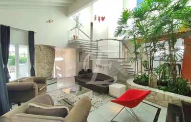 Imagem: A casa em condomínio possui 4 Dormitórios, 5 Banheiros, 4