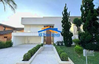 Imagem: A casa em condomínio possui 4 Dormitórios, 5 Banheiros, 5