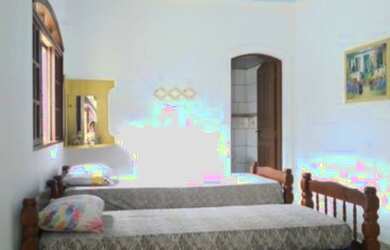 Imagem: A casa possui 1 Dormitório, 3 Vagas na garagem e está localizado