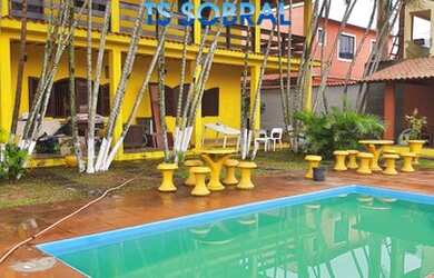 Imagem: A casa e possui 5 Dormitórios, Suítes, 5 Banheiros, 4 Vagas