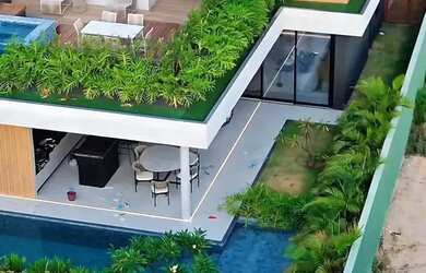 Imagem: A casa possui 4 Dormitórios, 5 Banheiros, 4 Vagas na garagem