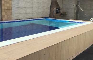 Imagem: A casa possui 2 Dormitórios, Acomodam 10 pessoas, 3 Vagas na